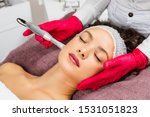 Beautiful woman receiving microneedling rejuvenation treatment. Mesotherapy. 