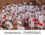 Small photo of LALIBELA, ETHIOPIA - MARCH 29, 2019: Christian priests in front of Bet Maryam, rock-cut church in Lalibela, Ethiopia