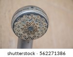 Hard water deposit and rust on shower tap