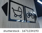 Signboard indicating facilities accessible for people in wheel chair or disability and for baby prams.