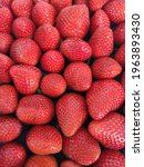 Small photo of Red ripe strawberries fullscreen background