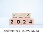 Wooden cubes with 2024 and goal, plan, action icon on white background. 2024 goals of business or life. Starting to new year. Business common goals for planning new project, annual, target achievement
