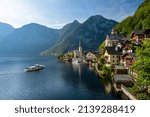 Tourist boat cruises on the idyllic Lake Hallstatt in front of the town of Hallstatt, Salzkammergut, Upper Austria, Austria, Europe