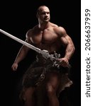 Small photo of Ferocious muscular ancient warrior barbarian with fantasy sword on black background