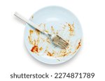 Small photo of A dirty plate with leftover sauce. Isolated on a white background.
