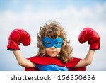 Superhero kid wearing boxing...