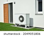 Air-Air Heat Pump for Heating and hot Water in Front of an new built Residential Building