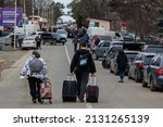 Small photo of Uzhhorod, Ukraine - February 26, 2022: Long queues of Ukrainian refugees fleeing Russian aggression to Europe across the Slovak border.