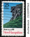 Small photo of SINGAPORE – MARCH 4, 2022: A stamp printed in USA shows Landscape with Cliff, New Hampshire, June 21, 1788, Ratification of the Constitution series, circa 1988