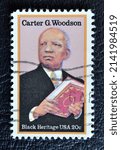 Small photo of SINGAPORE – APRIL 3, 2022: A stamp printed in USA shows Carter Godwin Woodson was an African-American historian, author, journalist, black heritage, circa 1997