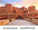 Agra Fort - Historic red sandstone fort of medieval India at sunrise. Agra Fort is a UNESCO World Heritage site in the city of Agra India.
