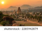 Small photo of Historic Virupaksha temple with scenic Hampi landscape and cityscape at sunset at Karnataka India
