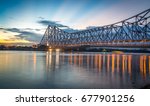 Howrah bridge - The historic cantilever bridge on the river Hooghly with twilight sky. Howrah bridge is considered as the busiest bridge in India.