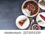 Homemade cheesecake with chocolate and berry. Sweet cottage cheese cake pie with fresh and chocolate topping, classic dessert om black concrete table copy space