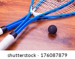 Close up of a squash rackets and balls 