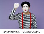 Small photo of Surprised confused preoccupied perplexed puzzled young mime man with white face mask wears striped shirt beret making knocking gesture isolated on plain pastel light violet background studio portrait