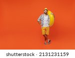 Small photo of Full body young smiling cheerful fun cool tourist man wear beach shirt hat hold inflatable ring look camera isolated on plain orange background studio portrait Summer vacation sea rest sun tan concept