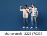 Small photo of Full body young two friends happy men 20s wear white casual shirts together hold scream in megaphone announces discounts sale Hurry up dow inner gesture isolated plain dark royal navy blue background