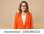 Young smiling cheerful happy fun employee operator business woman wear set microphone headset for helpline assistance work at call center office look camera isolated on plain beige background studio