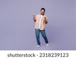 Small photo of Full body young Indian man he wear pink shirt white t-shirt casual clothes doing winner gesture celebrate clenching fists say yes isolated on plain pastel light purple background. Lifestyle concept
