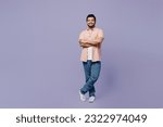 Small photo of Full body young Indian man he wears pink shirt white t-shirt casual clothes hold hands crossed folded look camera isolated on plain pastel light purple background studio portrait. Lifestyle concept