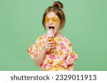 Little cute child kid girl 6-7 years old wearing casual clothes sunglasses eat icecream have fun isolated on plain pastel green background studio portrait. Mother