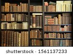 Old books on wooden shelf