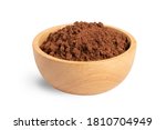 Cocoa powder in wooden bowl isolated on white background.