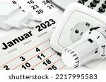 German calendar 2023  January with calculator, plug socket and heating thermostat   Tuesday Wednesday Thursday Friday 
