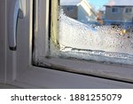 Closeup of a frozen window indoors in winter
