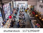 Small photo of Kuala Lumpur, Malaysia Oct 02 2016 - modern cafe with cozy industrial concept is a trend for the youngster, a coffee culture to hang around with friends, high angle view of a busy restaurant