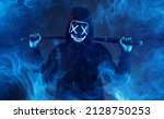 Small photo of Anonymous with a sword in hand. Dangerous hacker in mask. Internet, cyber crime, cyber attack, system, game, breaking and malware concept. Dark smoke background.
