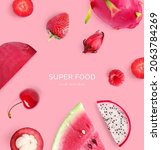 Small photo of Creative layout made of strawberry, raspberry, watermelon, dragon fruit, cherry and mangosteen on the pink background. Flat lay. Food concept. Macro concept.