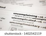 Small photo of Word or phrase uncomplaining in a dictionary.