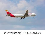 Small photo of Chicago, USA - July 20, 2022: An Iberia Airbus 340 landing at O'Hare International Airport. Iberia is the flag carrier and the largest airline of Spain.