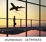 Image of businesswoman at airport looking at airplane taking off