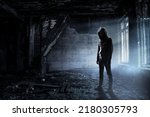 Small photo of Silhouette of man in hoody
