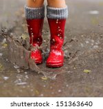 Child Wearing Red Rain Boots...