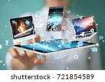 Tech devices connected to each other by businesswoman on blurred background 3D rendering