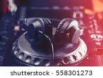 Small photo of DJ headphone on turn table. Disc jockey headphones on a cd player. Professional disk jokey audio equipment