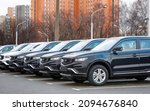 Small photo of Minsk, Belarus. Dec 2021. New car Geely Atlas parked in row outdoors, brand new cars for sale. Chinese crossover, SUV car Geely Atlas cars for sale. Parking lot of an authorized dealership Geely