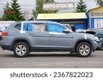 Small photo of Minsk, Belarus. Jun 14, 2022. VW Atlas car stand on parking lot, damaged car delivered from auction. Buying and shipping salvage American's automobiles. Damaged vehicle purchased at auction