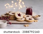 Christmas linzer shortbread cookies with raspberry jam