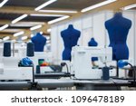 Interior of garment factory . Closes making atelier with several sewing machines. Tailoring industry, fashion designer workshop, industry concept