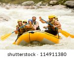 A group of adrenaline junkies conquering the wild river rapids, united as a team, in an extreme white-water rafting adventure challenge.