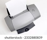 Small photo of a inkjet printer with white paper.