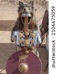 Small photo of Signifer equipment or standard bearer of the Roman legions. These roman officers covered their helmets with wolf furs