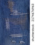 Small photo of Blue jeans denim background texture. Jeans fabric as material surface