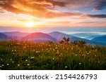 The sun sets over the mountain ranges. Location place Carpathian mountains, Ukraine, Europe. Perfect summertime wallpaper. Image of an magical sunset. Summer vacation. Discover the beauty of earth.