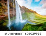 Perfect view of famous powerful Seljalandsfoss waterfall in sunlight. Dramatic and gorgeous scene. Popular tourist attraction. Location place Iceland, sightseeing Europe. Discover the world of beauty